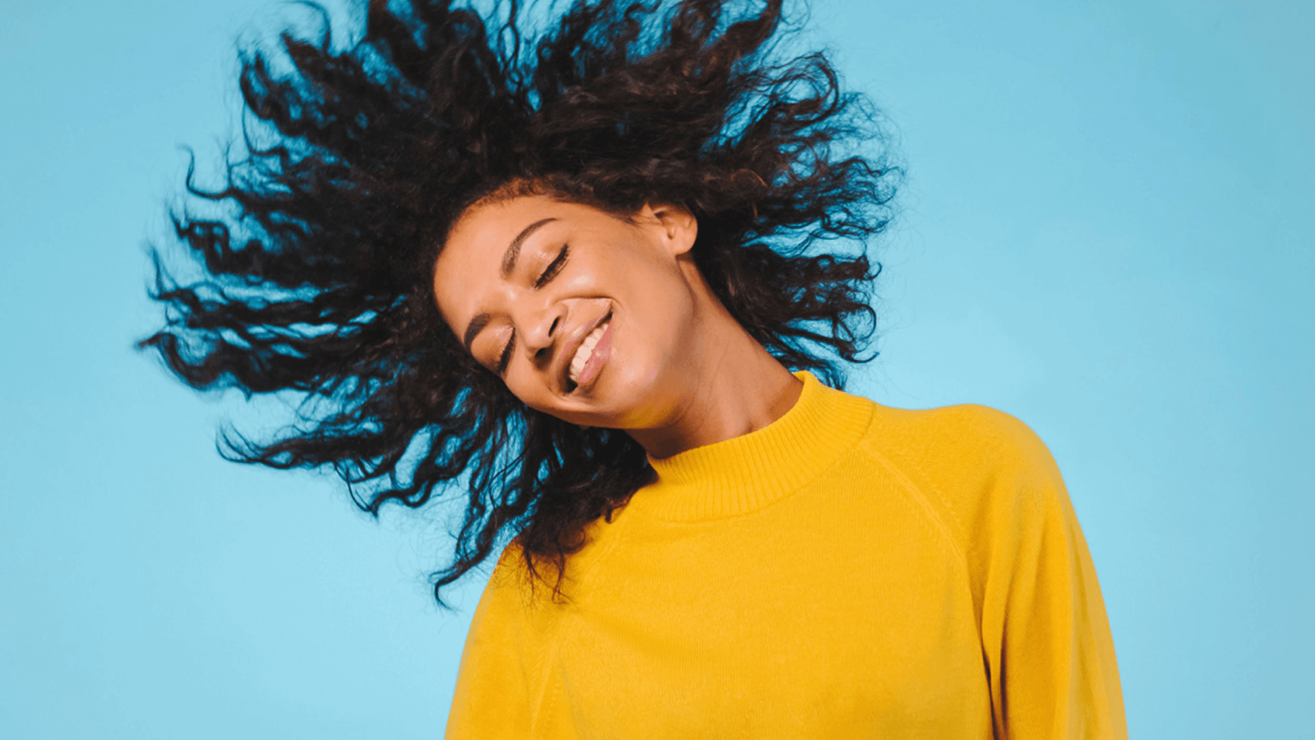 Happy woman with curly hair